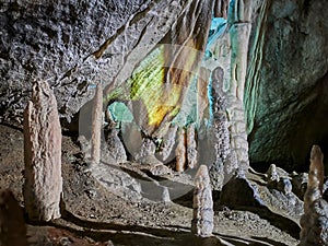 View of stalactites and stalagmites in an underground cavern - Postojna cave in Slovenia