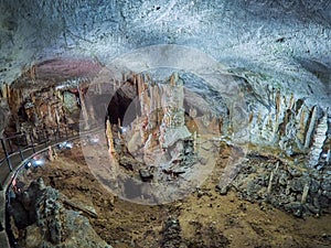 View of stalactites and stalagmites in an underground cavern - Postojna cave in Slovenia