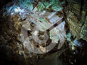 View of stalactites and stalagmites in an underground cavern - Postojna cave in Slovenia