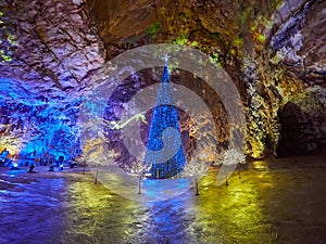 View of stalactites and stalagmites in an underground cavern - Postojna cave in Slovenia