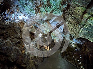 View of stalactites and stalagmites in an underground cavern - Postojna cave in Slovenia