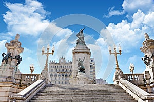 View of the statue of Ricardo Balbin in plaza del Congreso in Buenos Aires, surrounded by historic buildings, against a