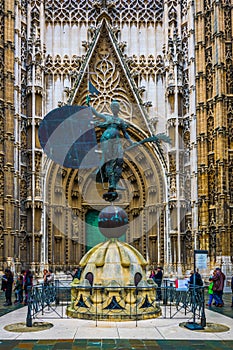 view of a statue situated in front of the main entrance to the cathedral in sevilla...IMAGE