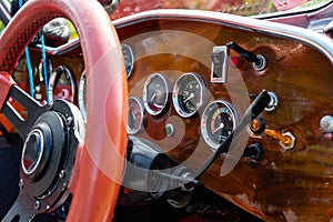 View of the steering wheel and dashboard of an old vintag car photo