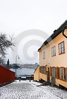 View of Stockholm city from a snowy street in Sodermalm, Sweden.