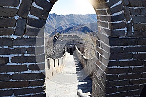 View through stone arch of an empty Great Wall of China