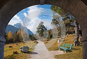 view through stone arch, geologic mountain trail near mittenwald