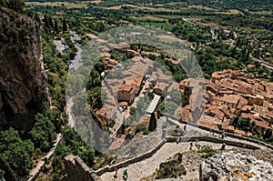 View of stone staircase, roofs and belfry in Moustiers-Sainte-Marie.