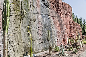 View of a stone wall with red, brown and black coloration