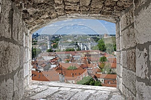 View from stone window of city center in Vilnius, Lithuania.  View from above of St. Stanislaus Cathedral on Cathedral Square,