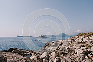 View from the stony coast of Montenegro to the Mamula island
