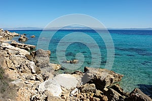 View of the stony coast and the turquoise sea in Greece
