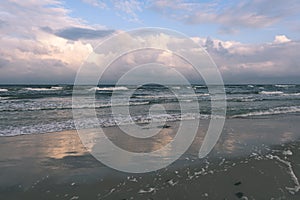 View of a stormy beach in the morning. - vintage film look