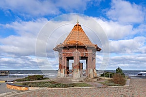 View of the stormy sea and the pump-room `Queen Louise` on the city boardwalk in Zelenogradsk, Kaliningrad region