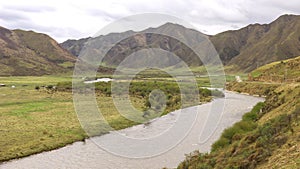 View of Stream, Grasslands and Hills