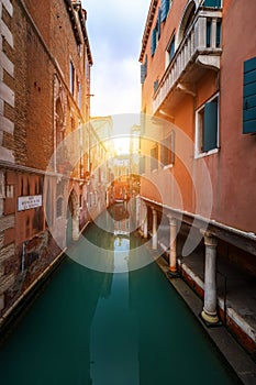 View of the street canal in Venice, Italy. Colorful facades of old Venice houses. Venice is a popular tourist destination of