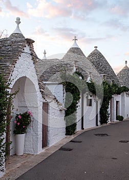 View of street of conical roof of traditional trulli house in Alberobello in the Itria Valley, Puglia Italy