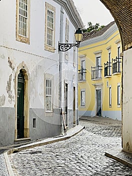 View of historical street in the old town Faro, Algarve, Portugal.