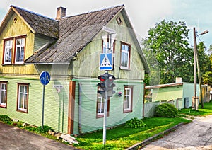 View of street with old wooden house in Parnu, Estonia