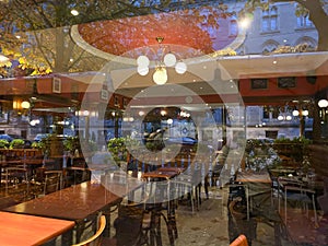View from the street of typical French cafe brasserie with empty seats