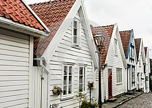 View of Street with white wooden houses in old centre of Stavanger. Norway