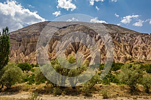 A view from the structure of Cappadocia. Impressive fairy chimneys of sandstone in the canyon near Cavusin village, Cappadocia.