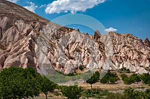 A view from the structure of Cappadocia. Impressive fairy chimneys of sandstone in the canyon near Cavusin village, Cappadocia.