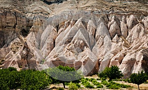 A view from the structure of Cappadocia. Impressive fairy chimneys of sandstone in the canyon near Cavusin village, Cappadocia.