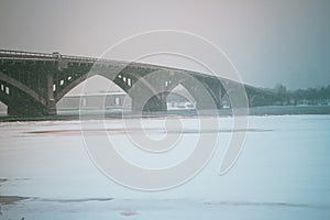 View of the subway bridge and Dnieper river in dense fog, misty landscape, Kyiv the capital of Ukraine, Eastern Europe