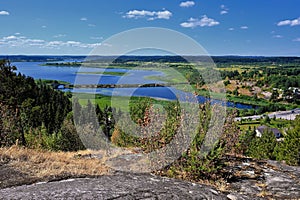 View of summer Karelia from height of hillfort on Mount Paaso near town Sortavala