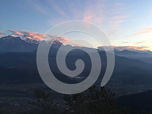 View of Sunrise above Himalayan Mountains from Sarangkot in Nepal.