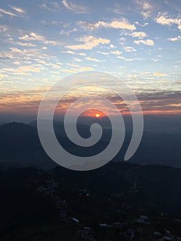 View of Sunrise above Himalayan Mountains from Sarangkot in Nepal.