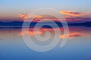 View of sunrise in lagoon Orbetello on peninsula Argentario. Italy