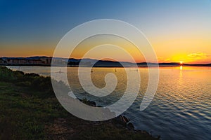 View of sunrise in lagoon Orbetello on peninsula Argentario. Italy