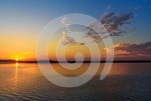 View of sunrise in lagoon Orbetello on peninsula Argentario. Italy