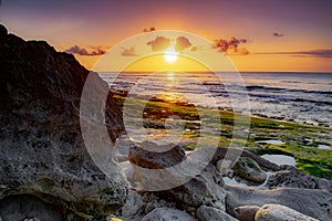view sunset of the cliffs on the beach in balangan-bali