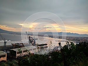 View of the sunset in the Gulf of Naples Mount Vesuvius and the port