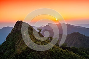 View of sunset over the Phu Chi Fah see from Phu Chi Dao viewpoint in Chiang Rai, Thailand.