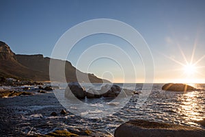 View of sunset over the water from the beach