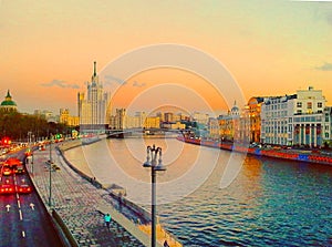 View of the sunset on the river, a residential skyscraper on Kotelnicheskaya Embankment, Moscow River, Bolshoy Ustinsky bridge. Mo