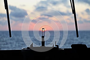 View of the sunset from the ships construction and navigational bridge.