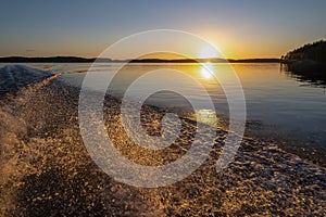 View of the sunset and the shore of The Lake Saimaa in the evening