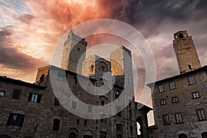 view at sunset of the towers of the town of san gimignano in tuscany