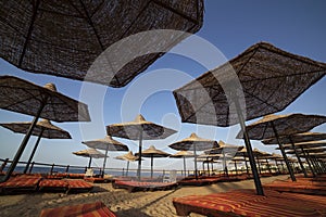 View on sunshades on beach in resort