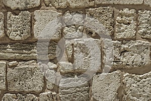 Surface of the stone wall of the masonry of Jerusalem stones