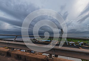 Cloudy Sunset Scenery From The Suriname Bridge In Paramaribo photo