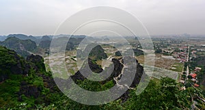 View of surrounding landscape from famous Hang Mua peak in Vietnam