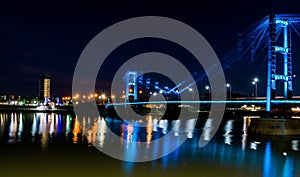 View of the Suspended Bridge Eng. Marcial Candioti on reflecting bokeh water in Argentina photo