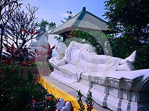 The View Of Sweet Beautiful Garden With White Buddha Sleeping at Brahmavihara Arama Monastery