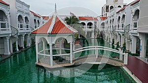 View of swimming pool inside the hotel. Green color of swimming pool at the sunny day